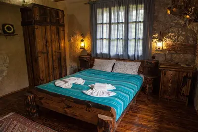 a bedroom with a bed with towels on it at Villa Mark in Kraevo