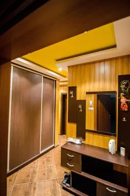 a room with a sliding door and a television at Kapana Comfy 2BR Apartment in Top Center in Plovdiv
