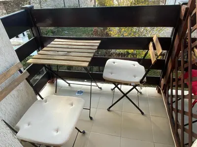 a balcony with a table and two chairs at ★ Stylish & Cozy Studios in Valentina Heights Boutique Hotel ★ in Bansko