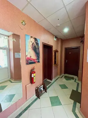 a room with a fire extinguisher on the floor of a building at Rooms Sonata in Kyustendil