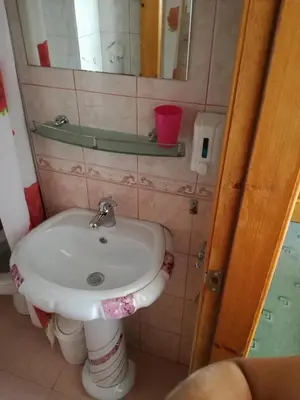 a bathroom with a sink and a mirror at Guest Rooms Grachenovi in Bansko