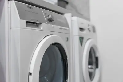 a group of three washing machines sitting next to each other at City Apartments - a brand new luxury & comfy. in Asenovgrad