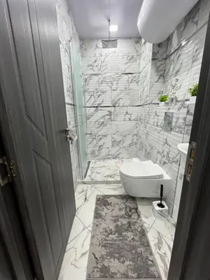 a bathroom with a toilet and a sink at City Apartments - a brand new luxury & comfy. in Asenovgrad