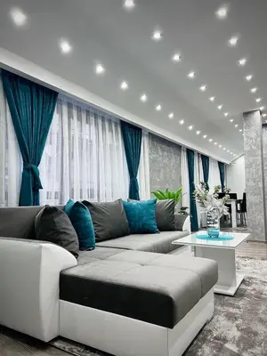 a living room with a couch and a table at City Apartments - a brand new luxury & comfy. in Asenovgrad