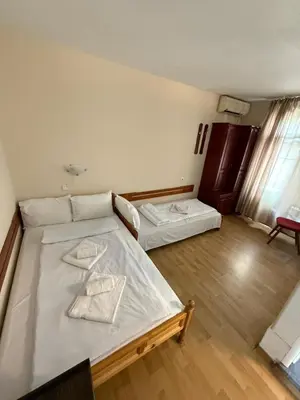 a bedroom with two beds in a room at Family Hotel Studio in Sandanski