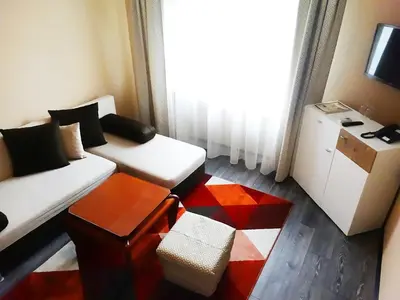a living room with a couch and a table at Hotel Simona Complex in Sofia