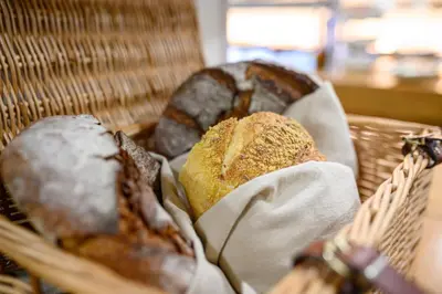 a basket with breads in it with at Spa Hotel Orbita in Blagoevgrad