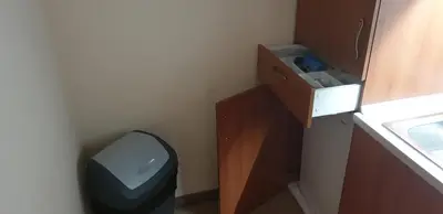 a small bathroom with a toilet and a sink at Simonen Apartments near the Gondola in Bansko