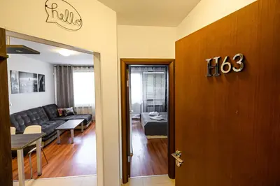 a door to a living room with a couch at Belvedere Holiday Club ...VIP ap. in Bansko