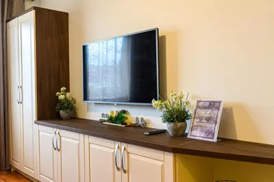 a flat screen tv on top of a cabinet at Belvedere Holiday Club ...VIP ap. in Bansko