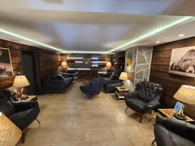 a lobby with couches and chairs in a room at Algara hut in Panichishte