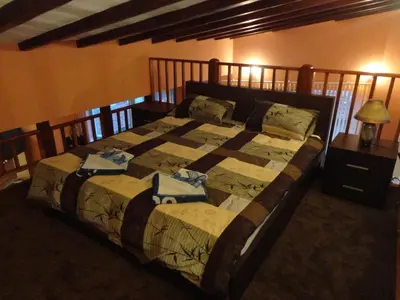 a bedroom with a large bed in a room at Mountain Dreams Apartment in Sapareva Banya