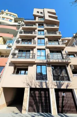 a tall building with balconies on the side of it at К's City Living with Free Parking in Plovdiv