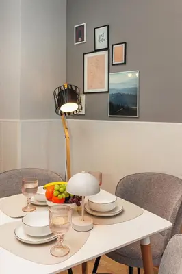 a white table with a bowl of fruit on it at К's City Living with Free Parking in Plovdiv