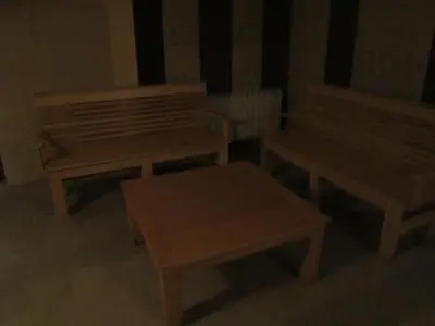 a room with two benches and a table at Хотел Магнолия, Hotel Magnoliya in Panichishte