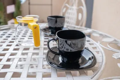 a table with two coffee cups on a table at 2-Bedroom Elegant Apartment in Mediterranean Style in Sofia