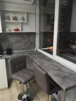 a kitchen with a desk and a chair and a window at Panorama Rooms in Sofia