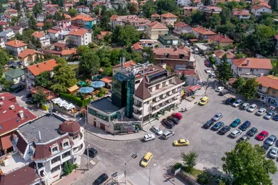an overhead view of a city with cars parked in a parking lot at Vitoshko Lale Hotel in Sofia
