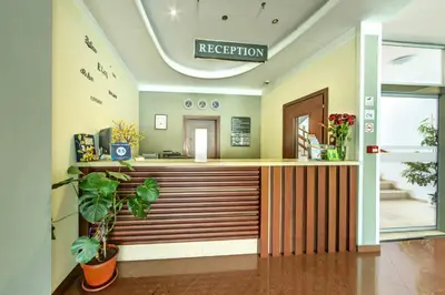 a lobby with a reception desk in a building at Vitoshko Lale Hotel in Sofia
