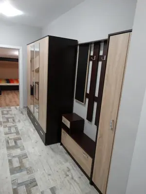 a room with a closet with a mirror and a door at Apartments DIEM in Samokov