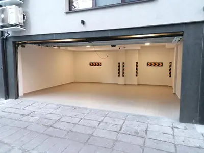 an empty garage with doors open on a building at Noris Apart with Garage in Plovdiv