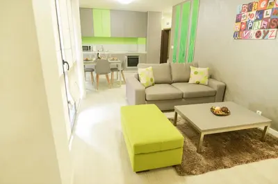 a living room with a couch and a table at Noris Apart with Garage in Plovdiv