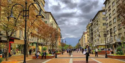 a group of people walking down a city street at 1-Bedroom Designer Apartment on Hristo Belchev Str in Sofia