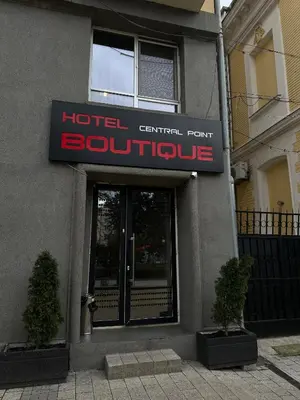 a hotelential point building with two plants in front of it at Central Point Boutique Hotel in Sofia
