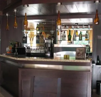 a bar in a restaurant with a counter top at Villa Cherven in Teteven