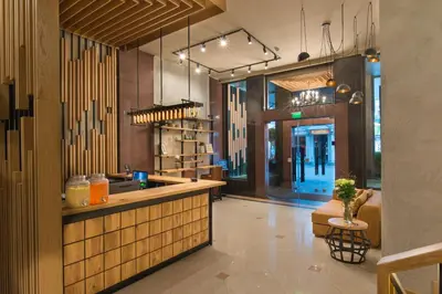 a kitchen with a counter in a restaurant at THE STAY Boutique Hotel Central Square - Free Compliments - Free Wi-Fi - TOP LOCATION - Nearby Paid Parking in Plovdiv