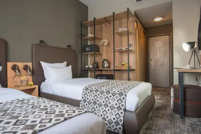 a hotel room with two beds at THE STAY Boutique Hotel Central Square - Free Compliments - Free Wi-Fi - TOP LOCATION - Nearby Paid Parking in Plovdiv