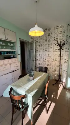 a dining room with a table and chairs in a kitchen at Your Space in Sofia in Sofia
