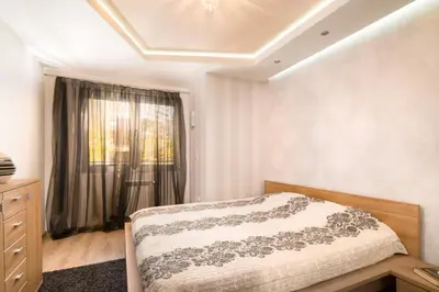 a bedroom with a bed and a window at Nice and cozy flat in the center in Sofia