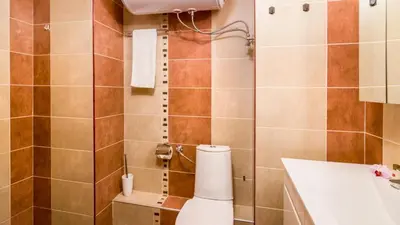 a bathroom with a toilet and a sink at Nice and cozy flat in the center in Sofia