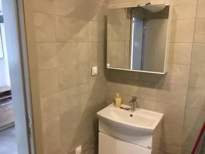 a bathroom with a sink and a mirror at ApartVel apartment 1 in Velingrad