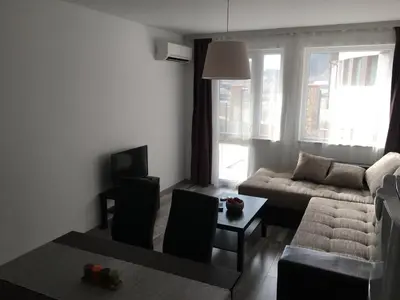 a living room with a couch and a table at ApartVel apartment 1 in Velingrad