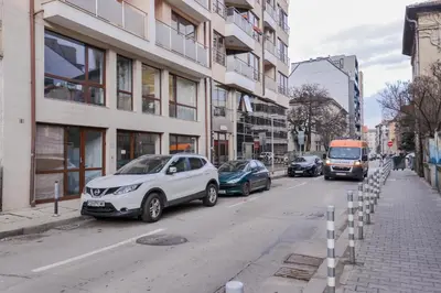 a street with cars parked on the side of the road at The Spot - fully equipped, central, modern studio by Flat Mаnager in Sofia