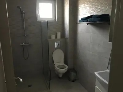 a small bathroom with a shower and a toilet at ApartVel apartment 2 in Velingrad