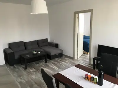 a living room with a couch and a table at ApartVel apartment 2 in Velingrad