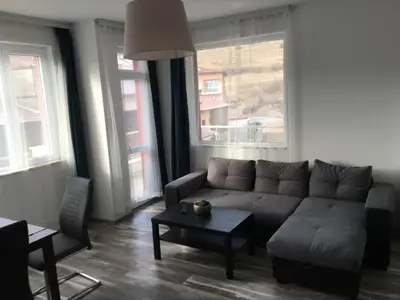 a living room with a couch and a table at ApartVel apartment 3 in Velingrad