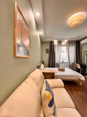 a living room with a couch and a bed at Exceptional Refurnished Studio TOP Location in Sofia