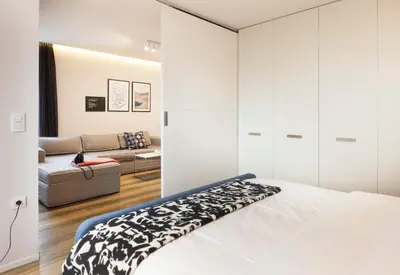 a bedroom with a bed and a couch at Set-up Design in Sofia