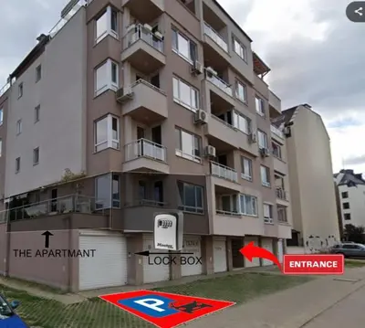 an apartment building with a sign in front of it at Set-up Design in Sofia