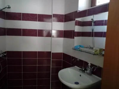 a bathroom with a sink and a mirror at Apartment Аlex in Grand Monastery Pamporovo in Pamporovo