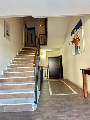 a staircase in a building with a stair case at House Laudis in Bansko
