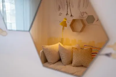 a bedroom with a bed with pillows and a lamp at Two Bedroom Apartment Near to Doctors Garden in Sofia