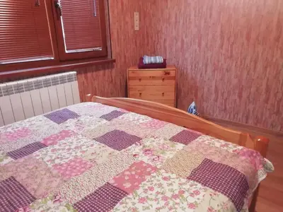 a quilt on a bed in a bedroom at Apartment Lagera 55 in Sofia