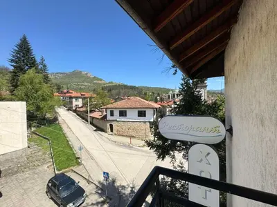 a balcony of a house with a view of a street at Семеен Хотел Вит in Teteven