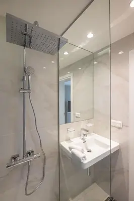 a bathroom with a sink and a shower at Vitosha Blvd Luxury 2-Bedroom, 2-Bathroom with Balcony in Sofia