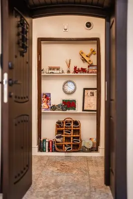 a hallway with a door leading into a room filled with toys at 29A Guesthouse in Plovdiv